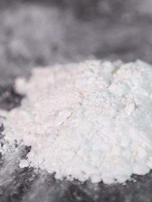 Synthetic MDMA Powder white form poured on desk – premium quality from Psychedelic Deals