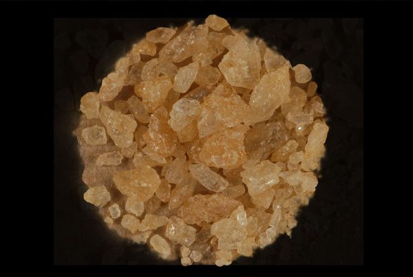 Premium Pure MDMA Crystal on Black Cloth – By Psychedelic Deals 98% Pure MDMA Crystal arranged on black cloth; high-purity premium MDMA Crystal from Psychedelic Deals.