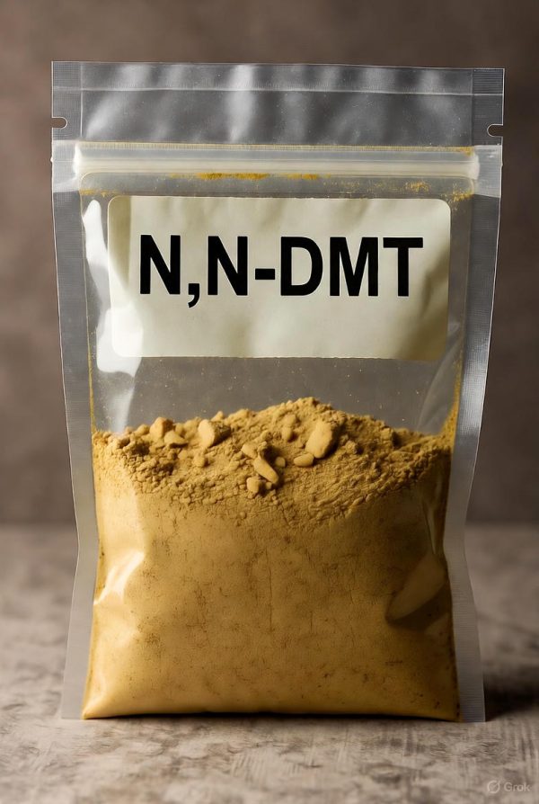 A transparent laboratory bag filled with high-purity N,N-DMT in its authentic brown powder form, featuring a clear N,N-DMT label in black ink.