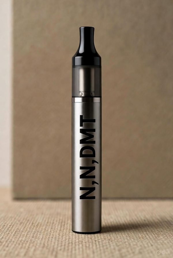 N,N,DMT Vape Pens A sleek gray N,N,DMT Vape Pen showing golden-hued oil at the top, standing upright against a soft blurred background with the text N,N,DMT Vape Pens printed in black.