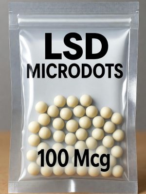 A white resealable bag filled with tiny LSD Microdots, clearly labeled with the text LSD Microdots 100 Mcg in bold black font.