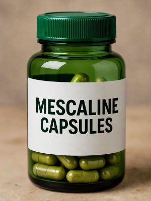 Green bottle labeled mescaline capsules with white paper label and mescaline capsules visible inside