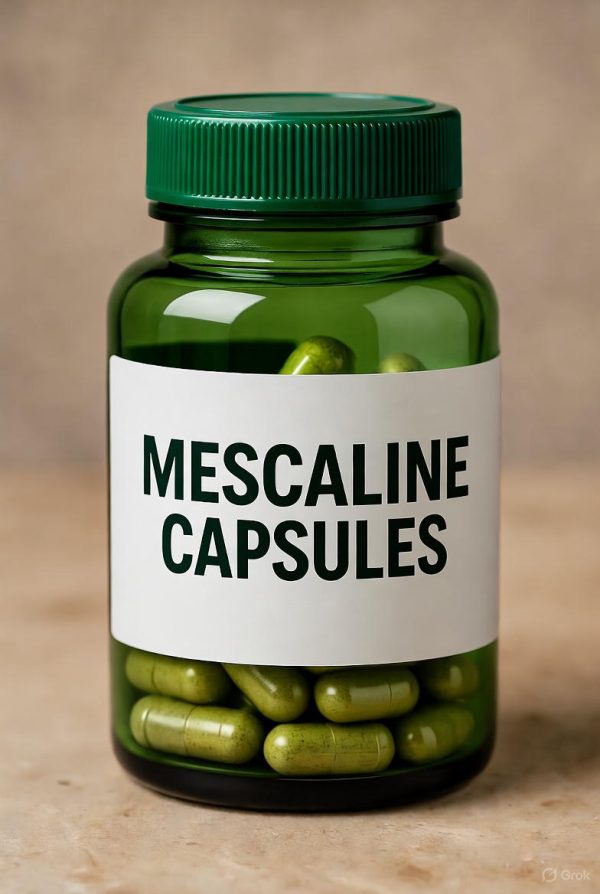 Mescaline Capsules Green bottle labeled mescaline capsules with white paper label and mescaline capsules visible inside